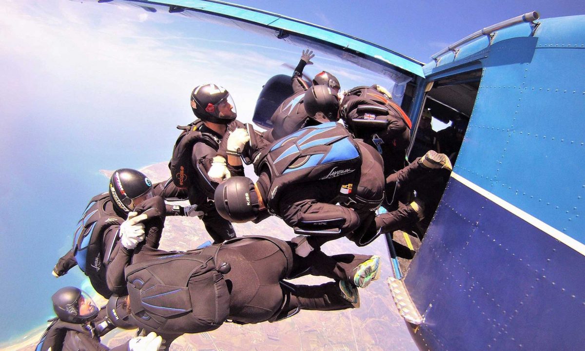 experienced skydiving team exist skydiving aircraft wearing sun path rigs