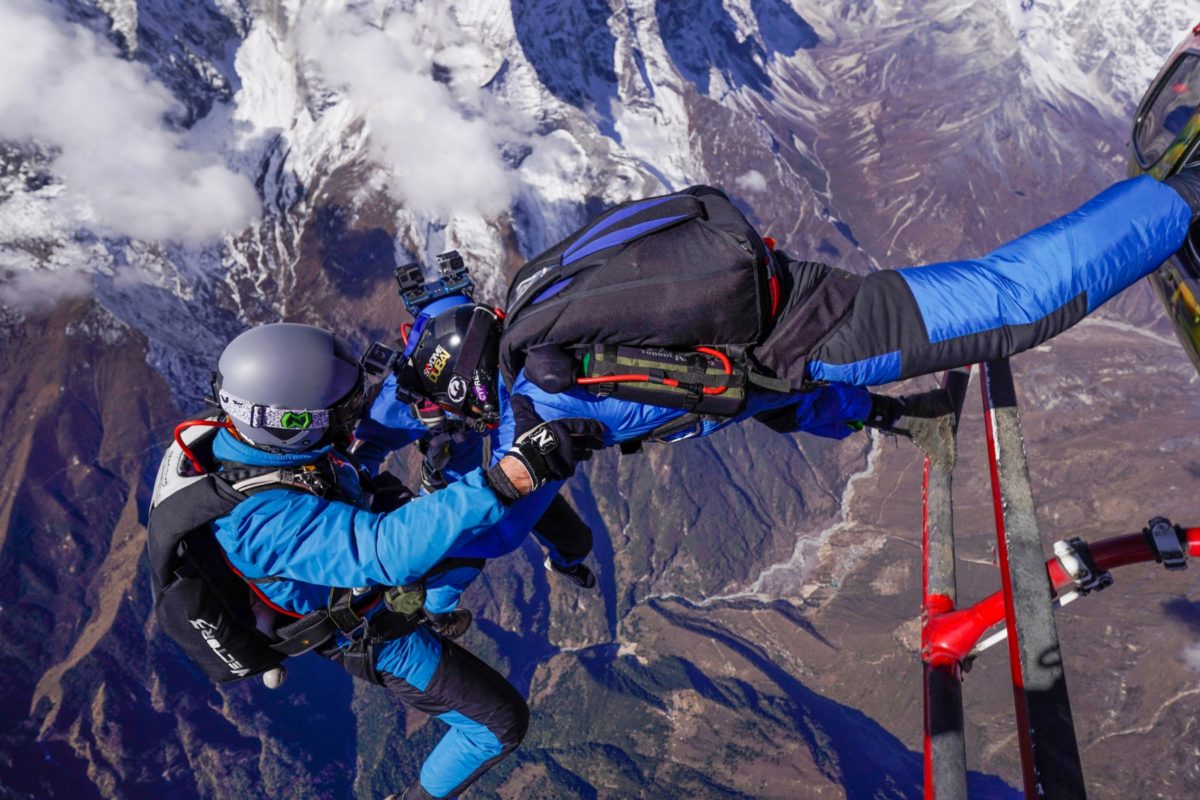 experienced skydivers jump out of helicopter at Mt. Everest wearing Sun Path rigs